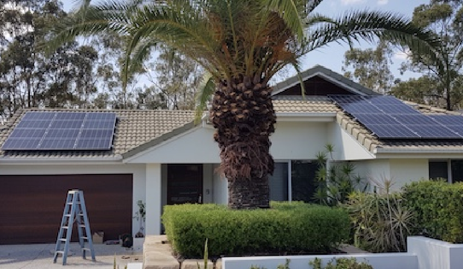 A single storey home facade with solar panels.
