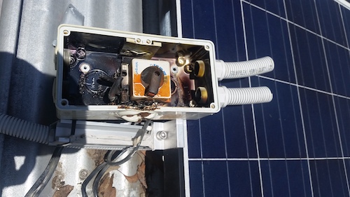 Solar panel electrics in need of emergency electrical repair.